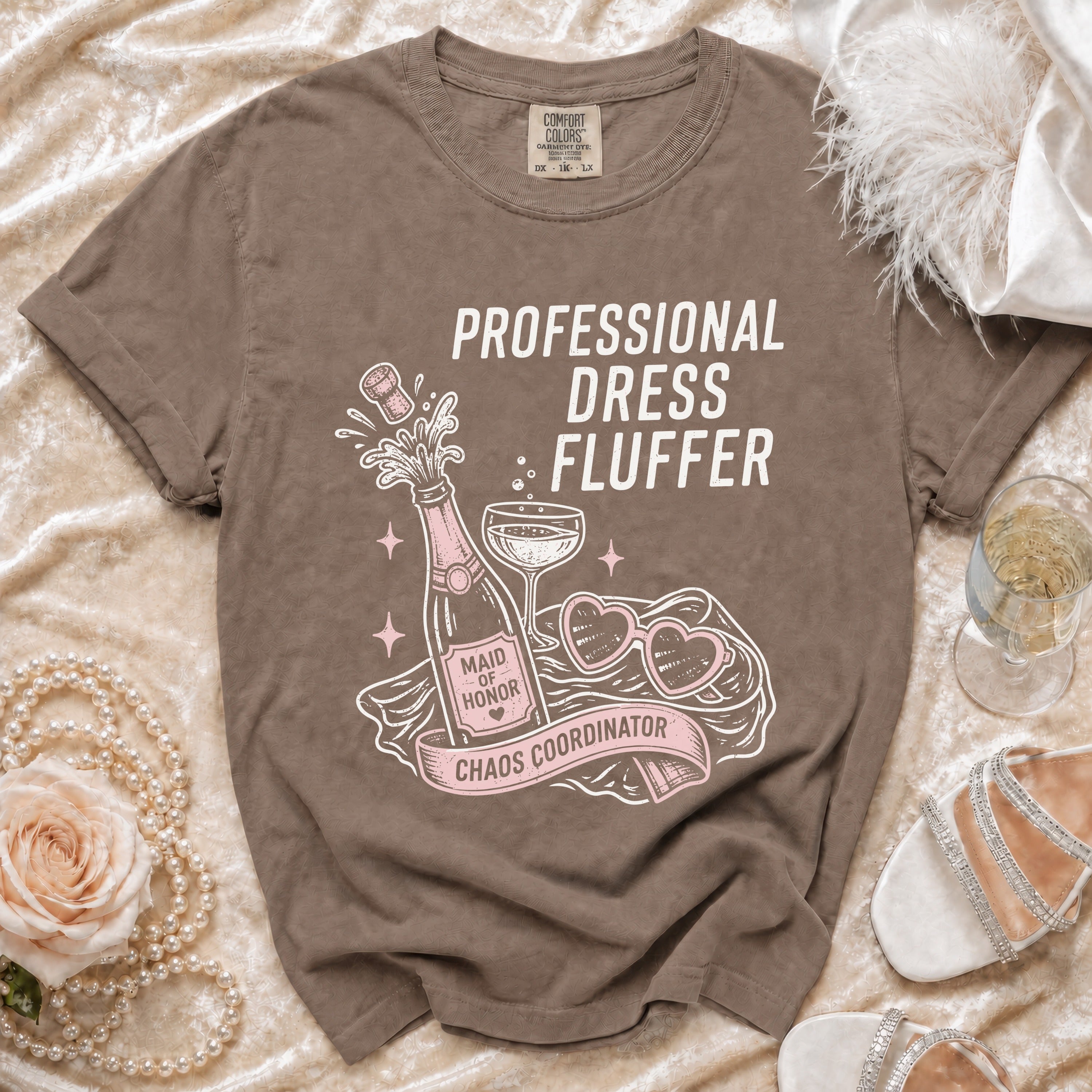Brown t-shirt with "Professional Dress Fluffer Maid of Honor Chaos Coordinator" text and graphics.