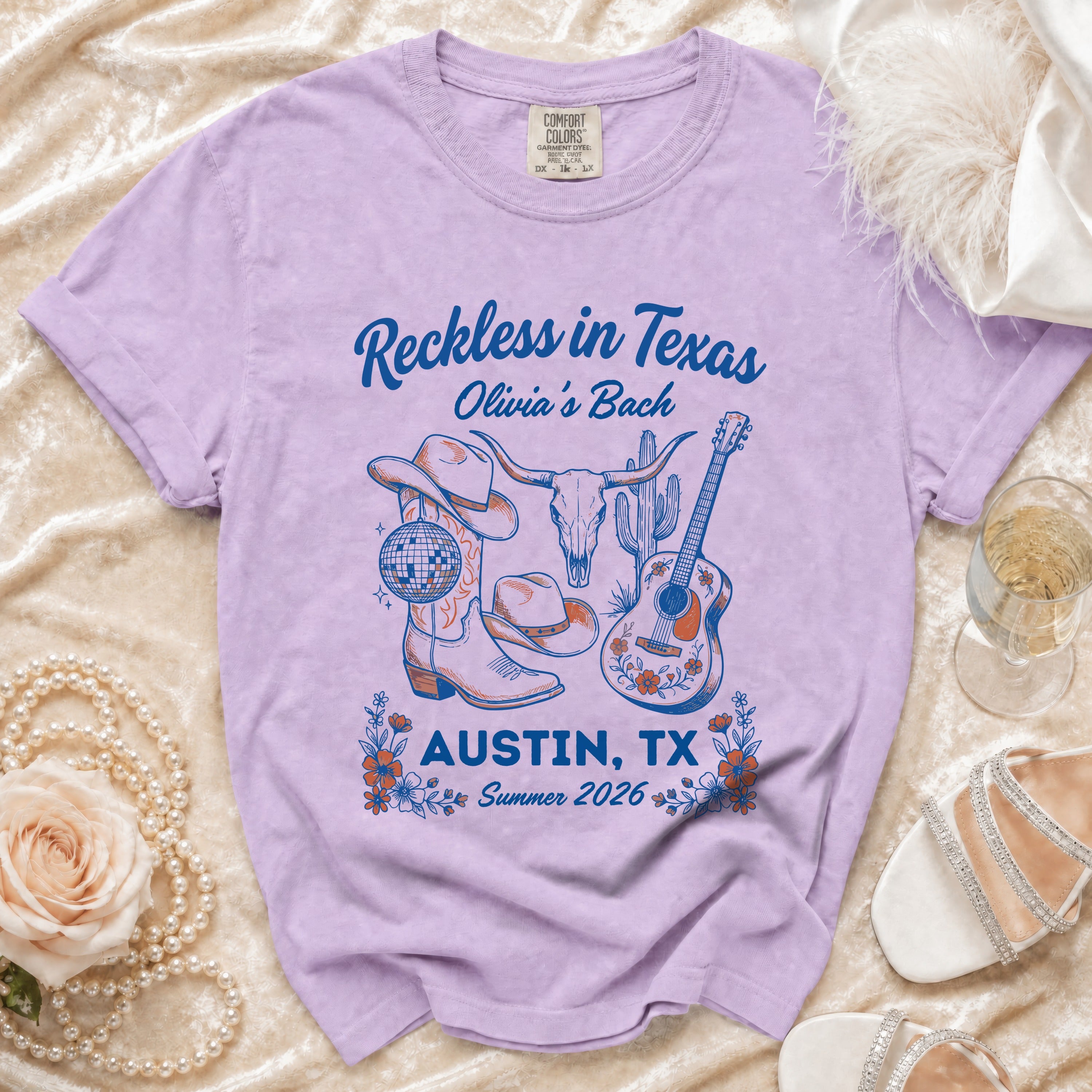 Purple t-shirt with "Reckless in Texas Olivia's Bach Austin, TX Summer 2026" design.