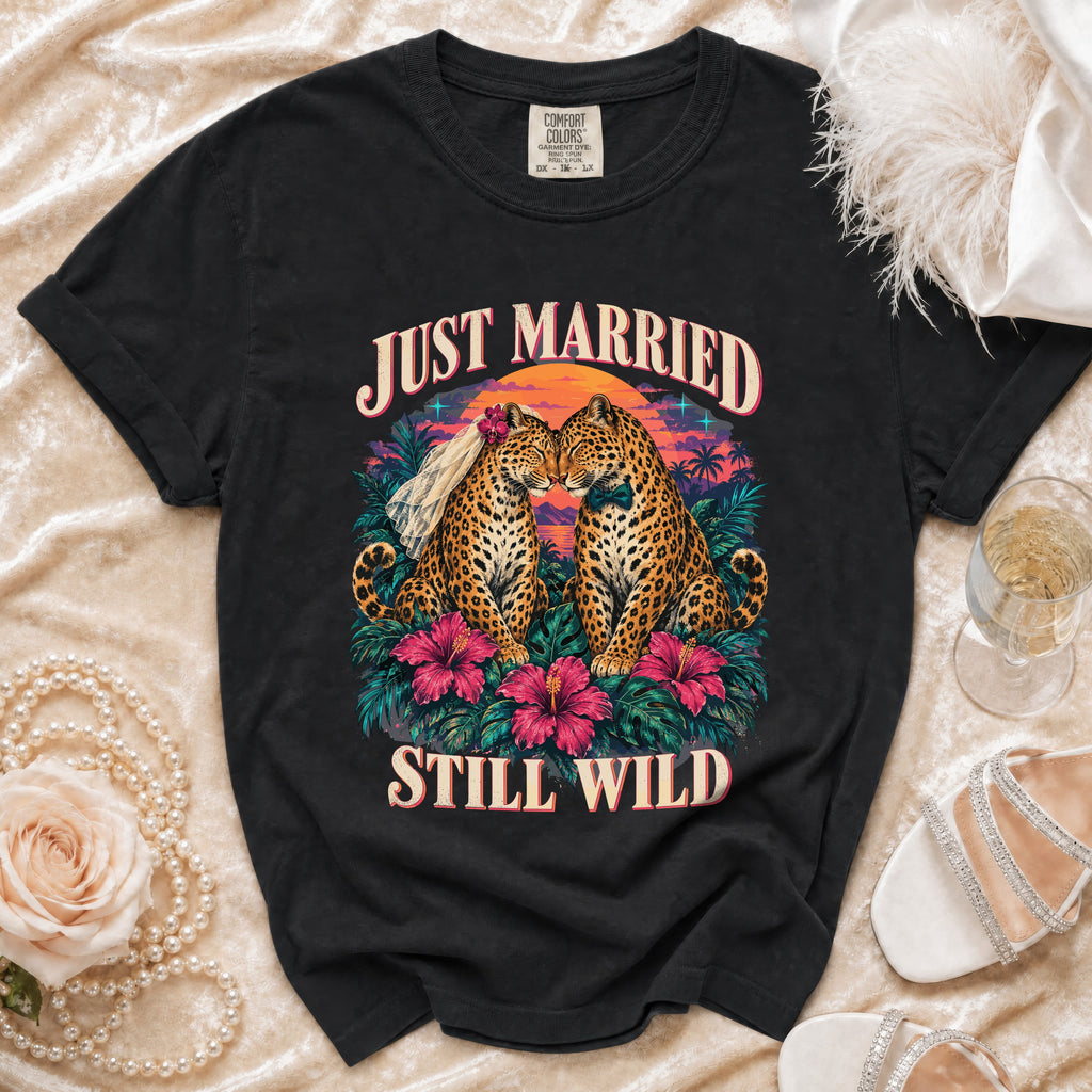 Black t-shirt with "Just Married Still Wild" text and two leopards in a tropical sunset.