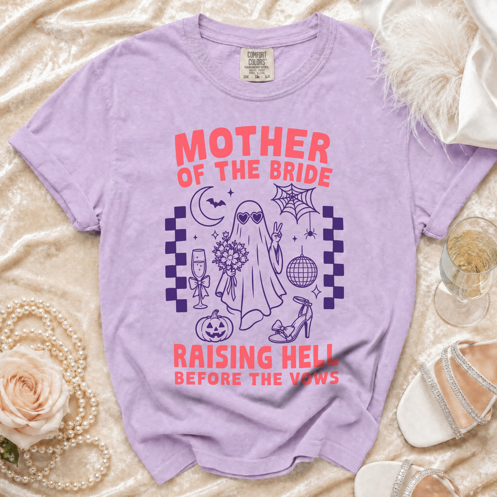 Purple t-shirt with "Mother of the Bride Raising Hell Before the Vows" graphic.