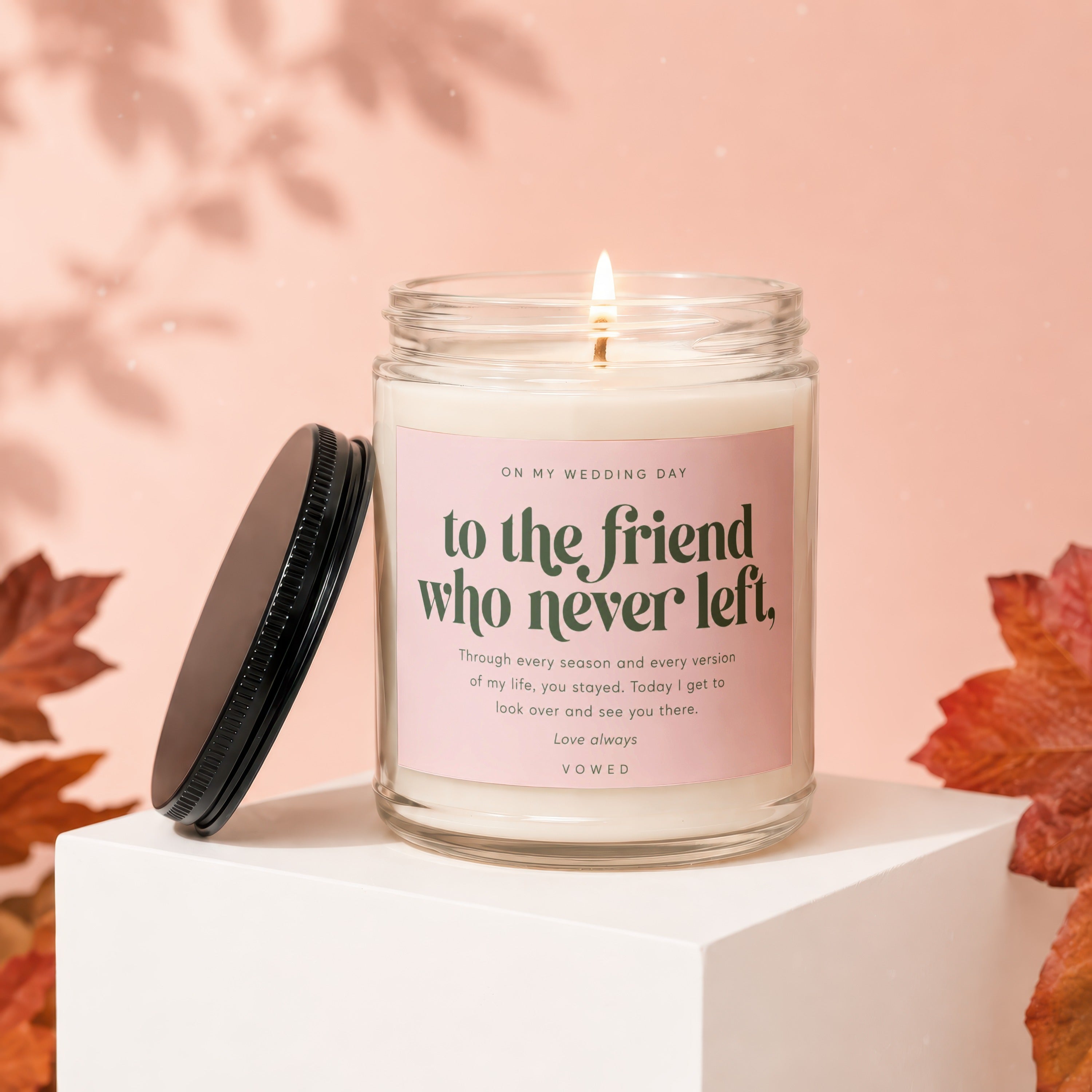 Candle with the text "to the friend who never left" on a pink label.