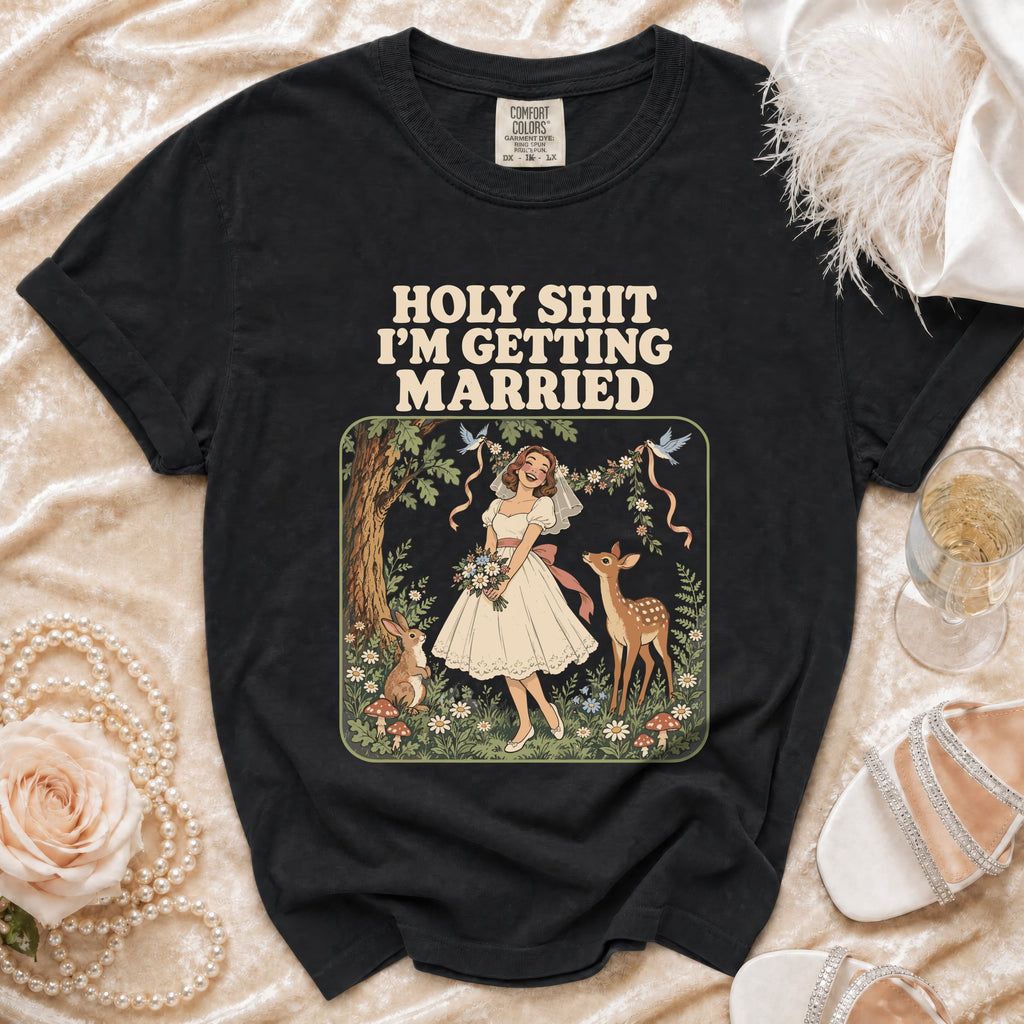 Black t-shirt with "HOLY SHIT I'M GETTING MARRIED" text and forest illustration.