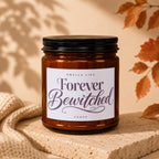 Brown glass candle labeled "Smells like Forever Bewitched Vowed."