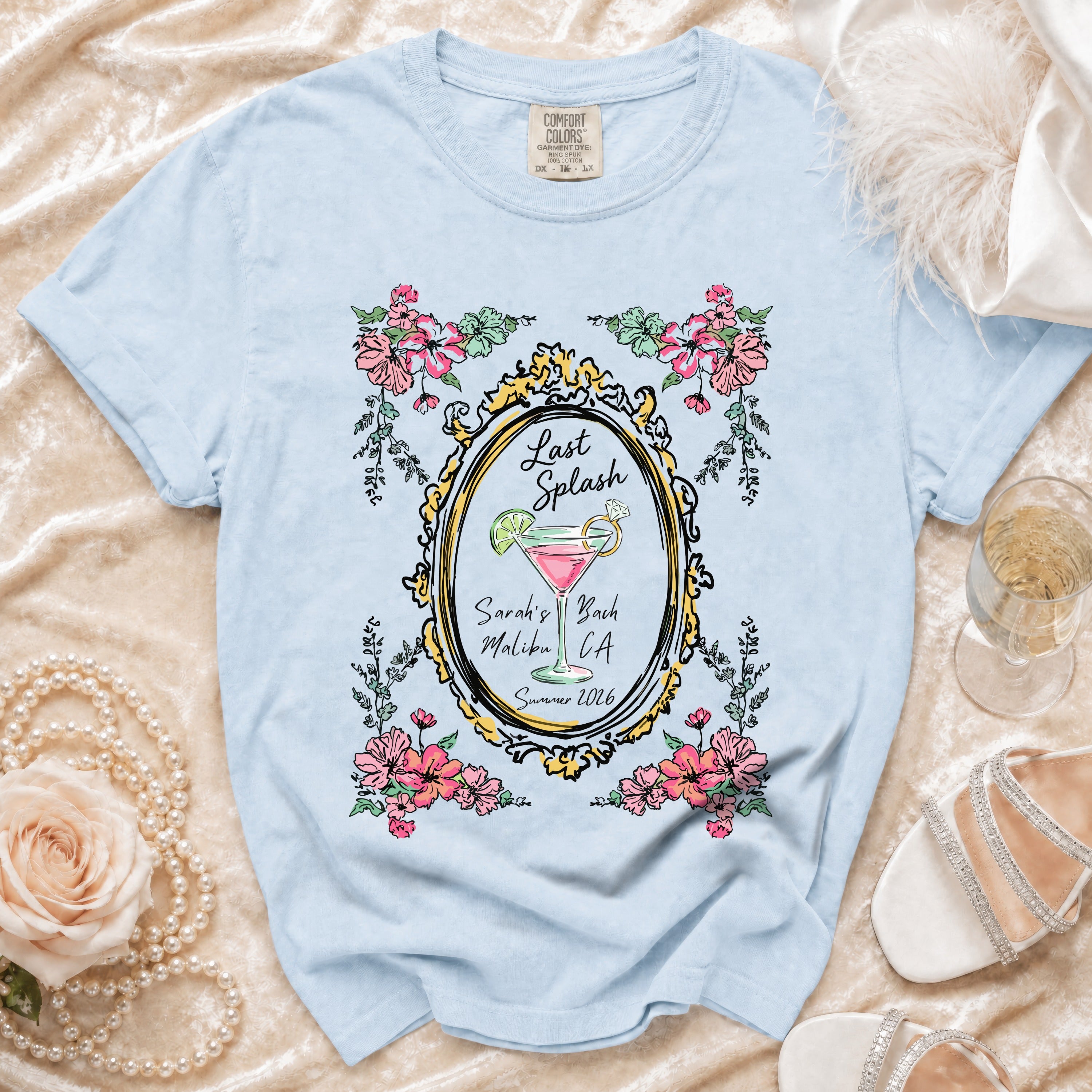 Light blue t-shirt with "Last Splash Sarah's Bach Malibu CA Summer 2026" text.