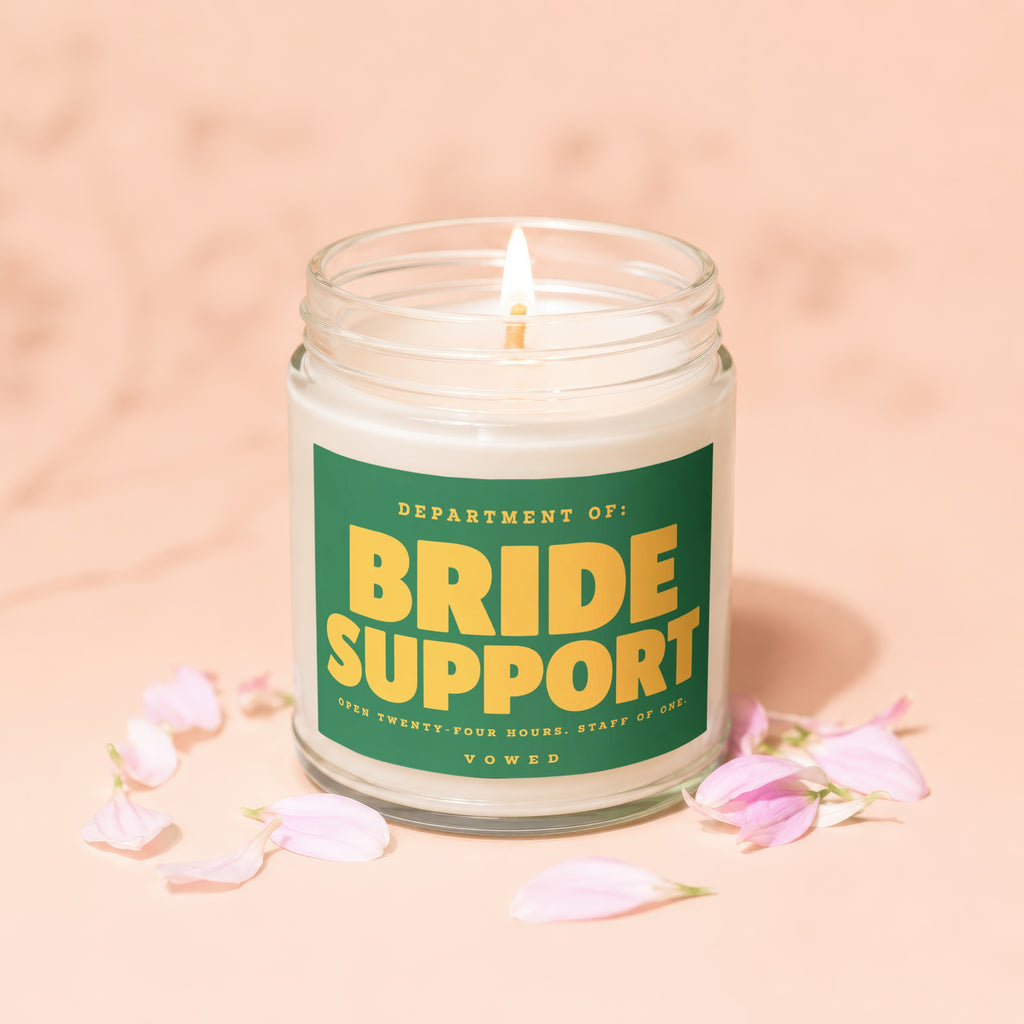 Jar candle labeled "Bride Support" with "Vowed" at the bottom.