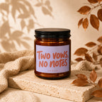 Amber jar candle with "Two vows, No notes" text on label.