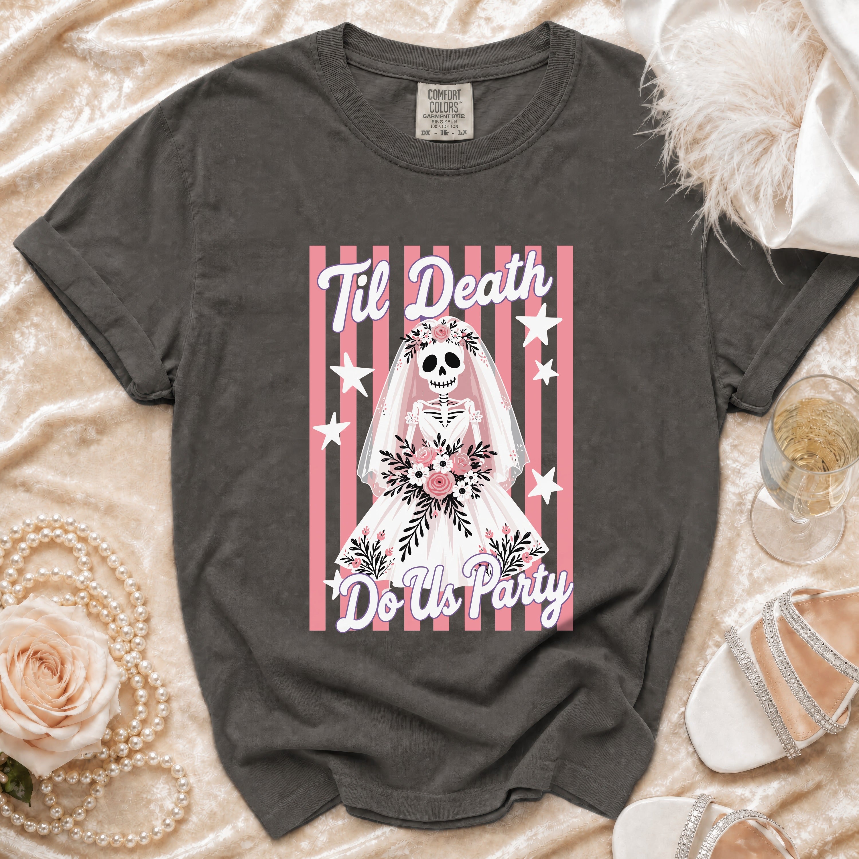 Dark gray t-shirt with skeleton bride graphic saying "Til Death Do Us Party".