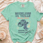 Comfort Colors shirt: Reckless in Texas, Olivia's Bach, Austin, TX, Summer 2026.