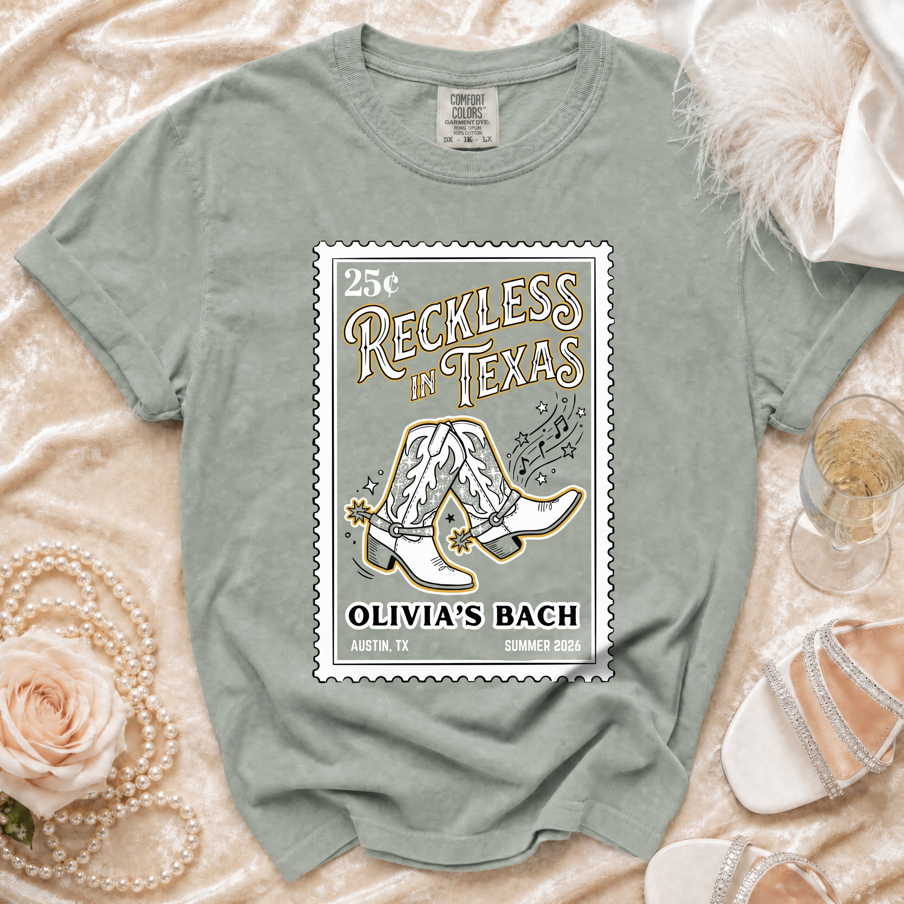 Shirt with "Reckless in Texas" and cowboy boots graphic.
