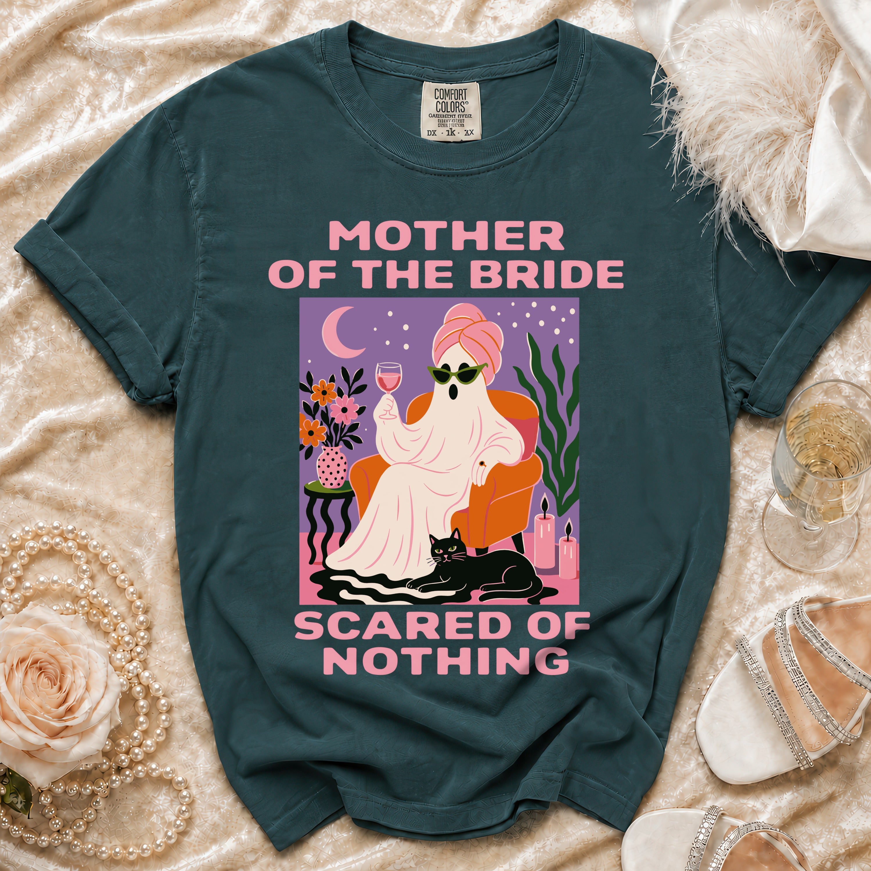 Dark teal t-shirt with "Mother of the Bride Scared of Nothing" graphic.
