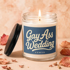 Glass candle with navy label reading "Gay Ass Wedding VOWED"
