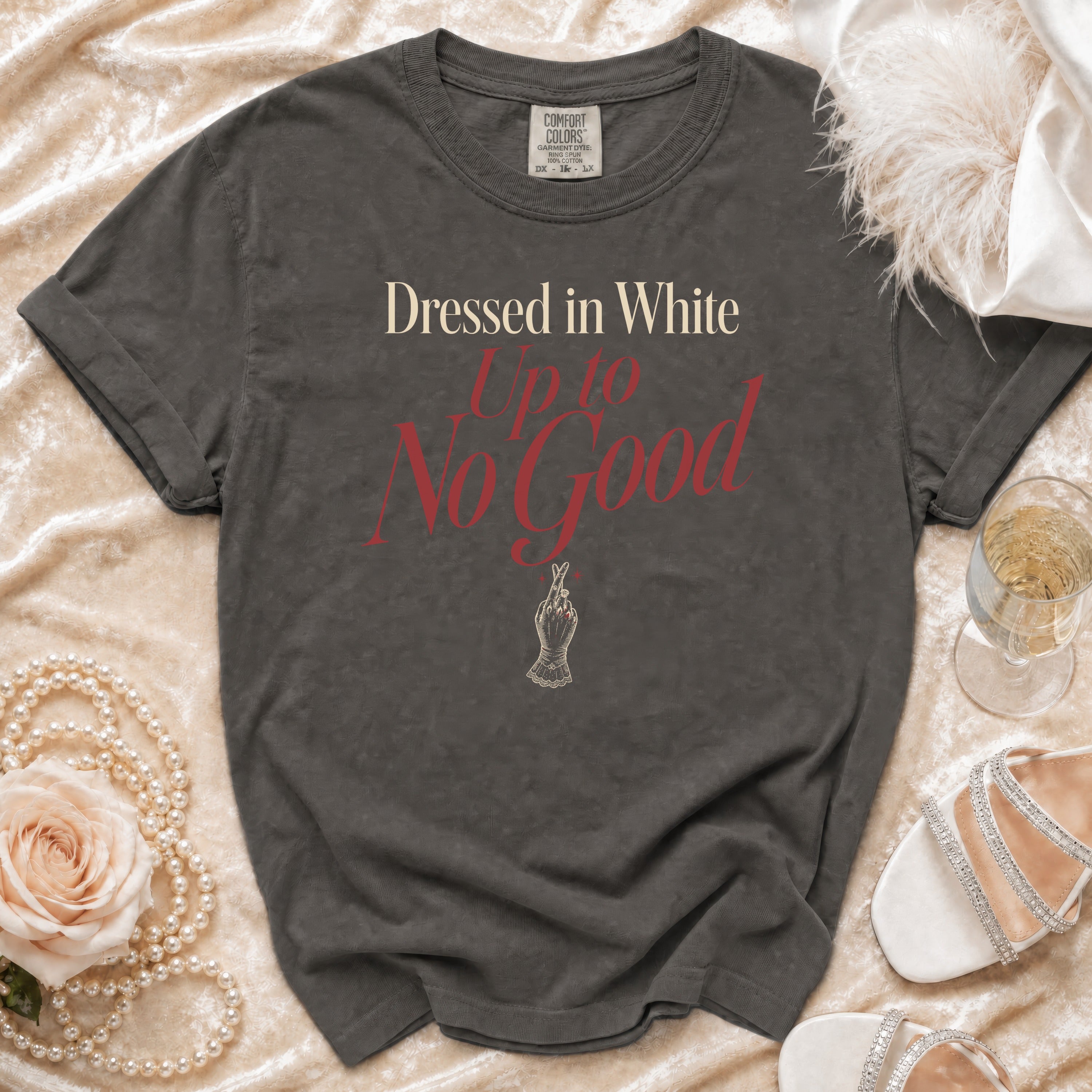Comfort Colors shirt with "Dressed in White Up to No Good" text and hand graphic.
