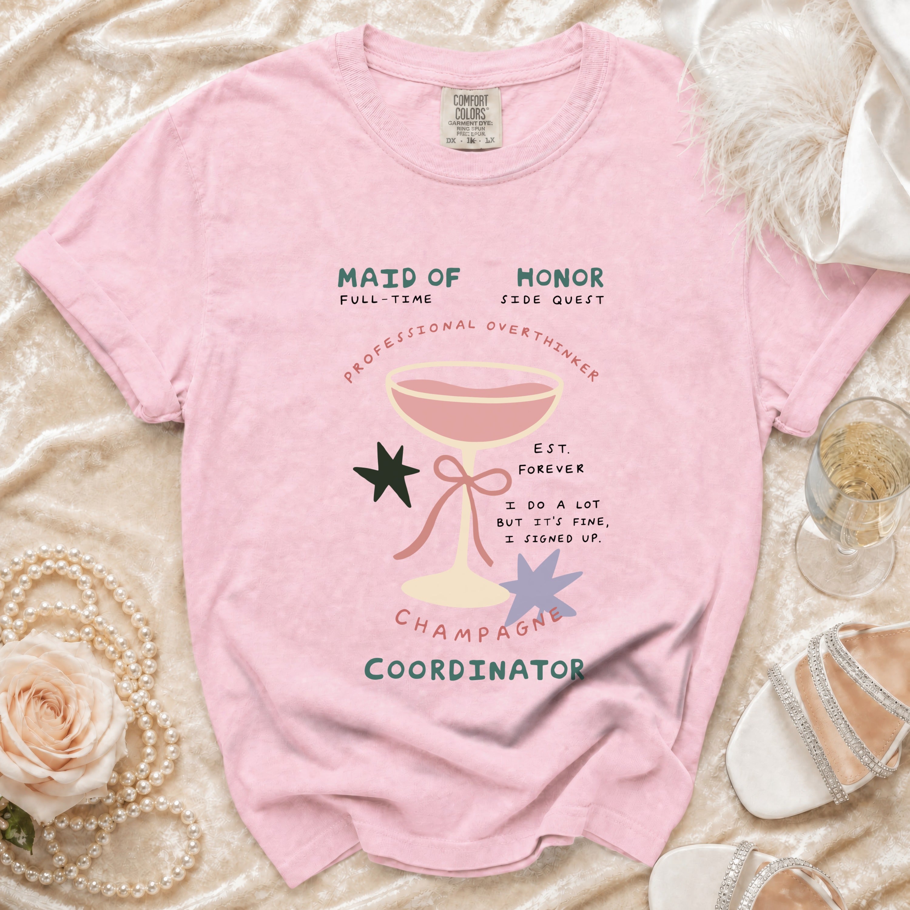 Pink t-shirt with "Maid of Honor Champagne Coordinator" and graphics.