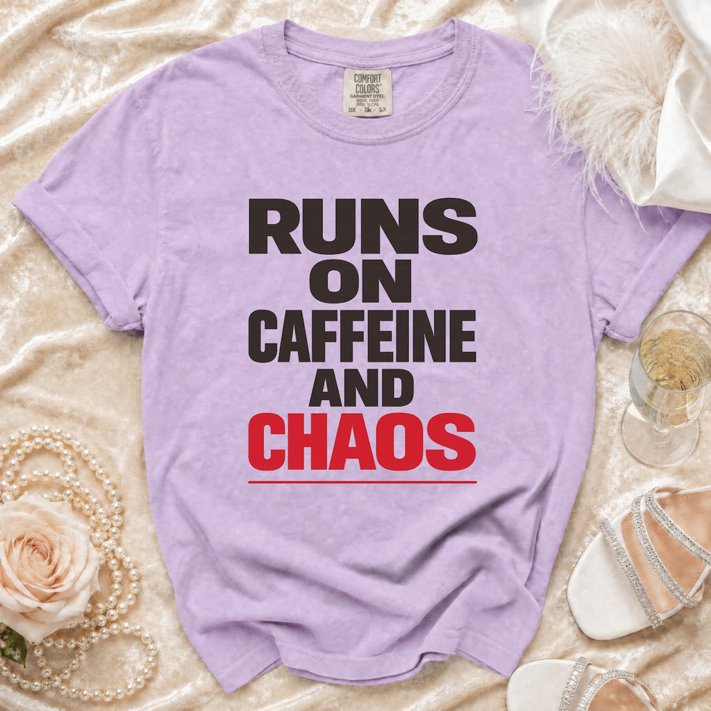 Purple t-shirt with "Runs on Caffeine and Chaos" text.