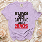 Purple t-shirt with "Runs on Caffeine and Chaos" text.