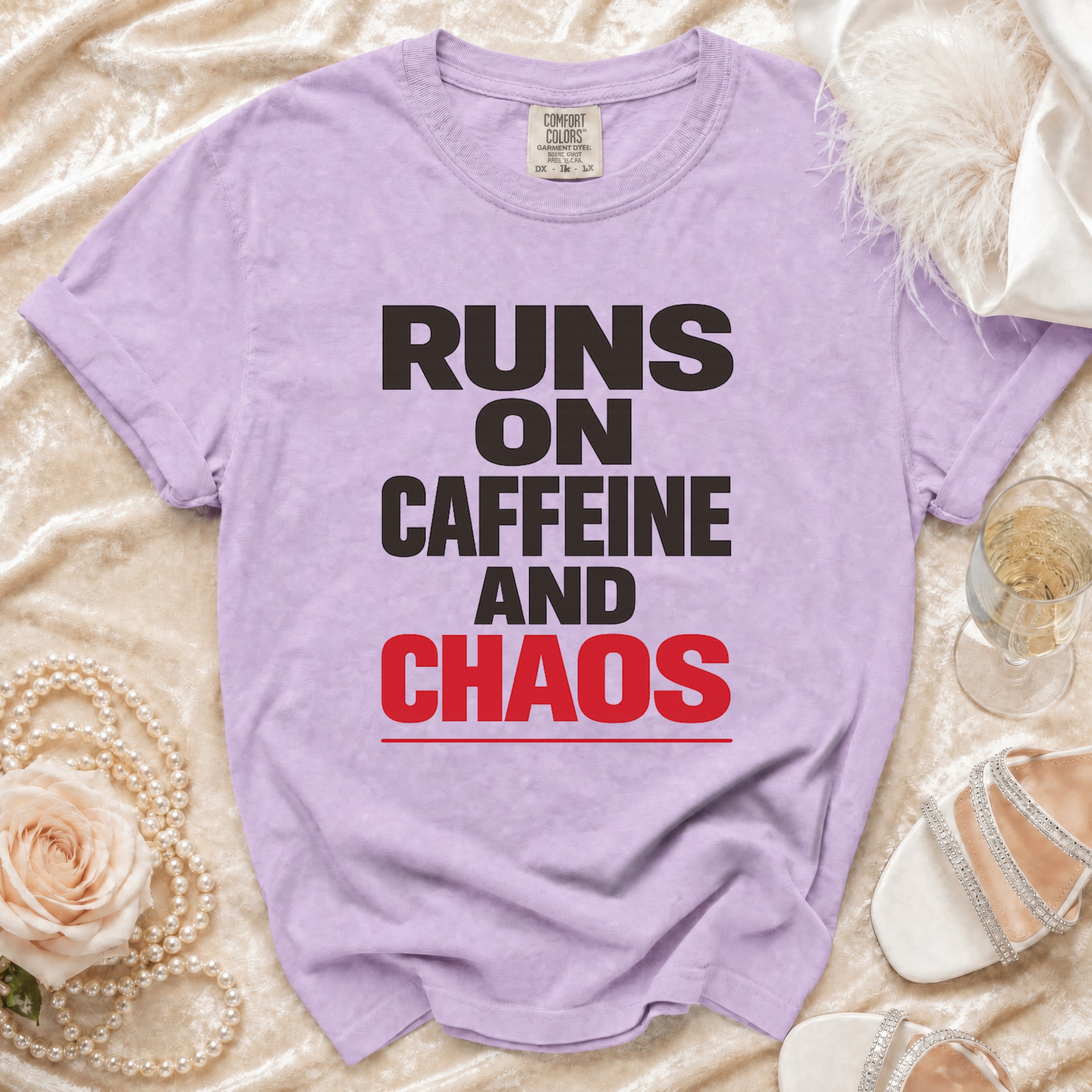 Purple t-shirt with "Runs on Caffeine and Chaos" text.