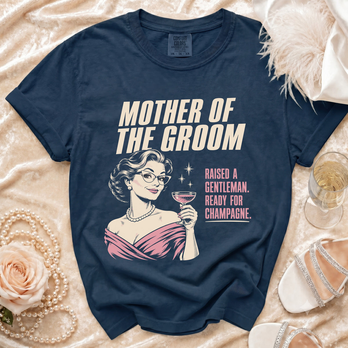 Navy t-shirt with "Mother of the Groom" text and a woman holding champagne.