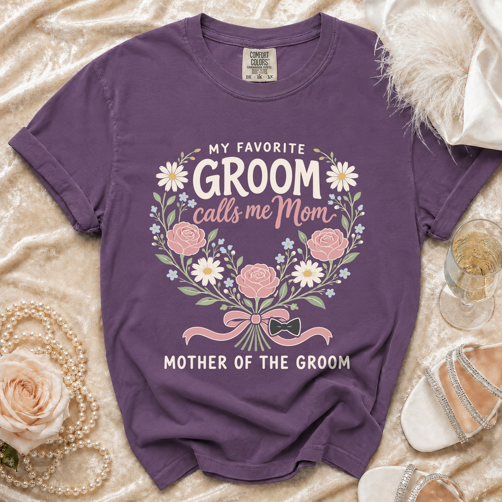 Purple t-shirt with "My Favorite Groom calls me Mom, Mother of the Groom" text and floral design.