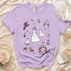 Lavender t-shirt with wedding icons: dress, veil, cake, car, and "JUST MARRIED" text.