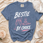 Blue t-shirt with "BESTIE Maid of Honor BY CHOICE" text and graphics.