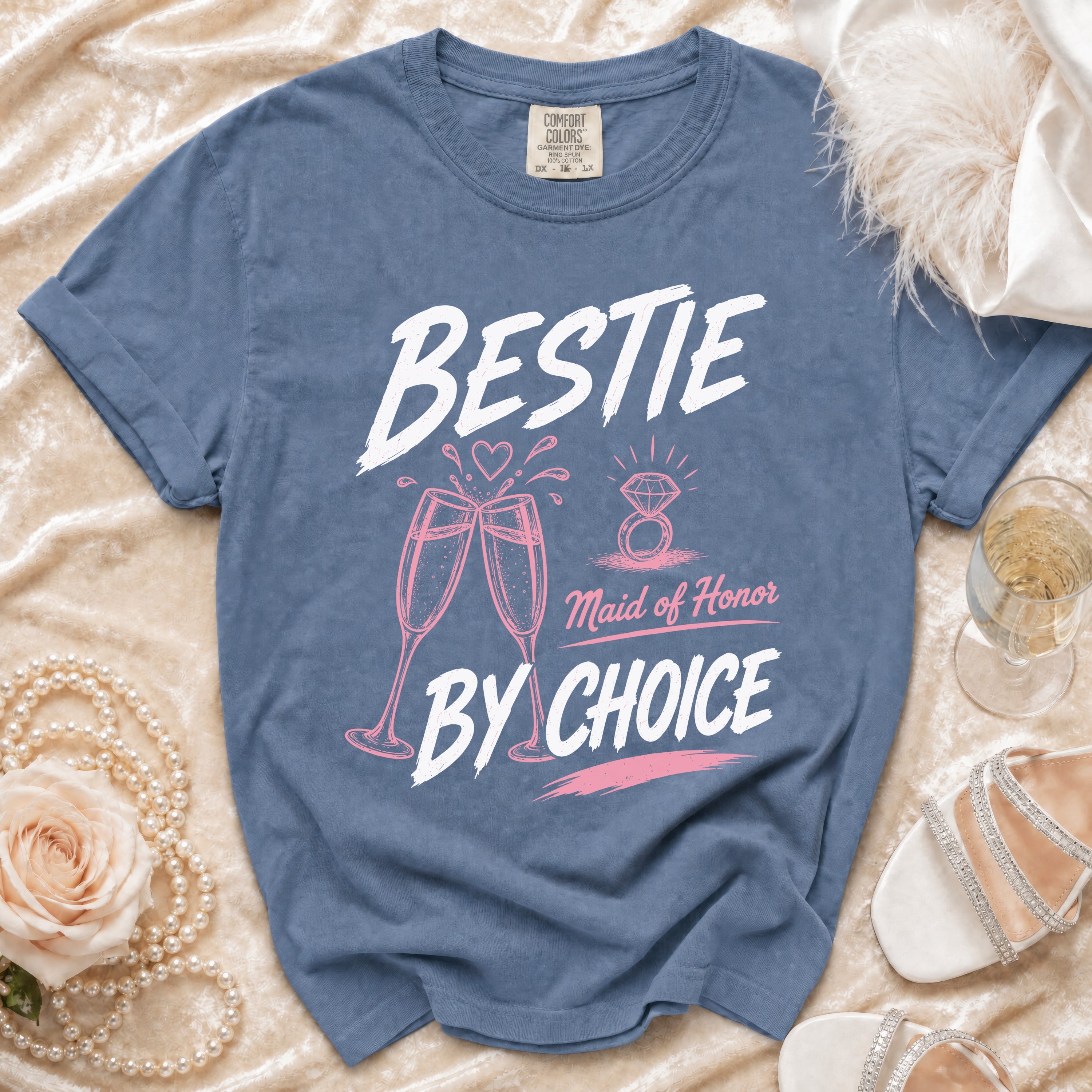 Blue t-shirt with "BESTIE Maid of Honor BY CHOICE" text and graphics.