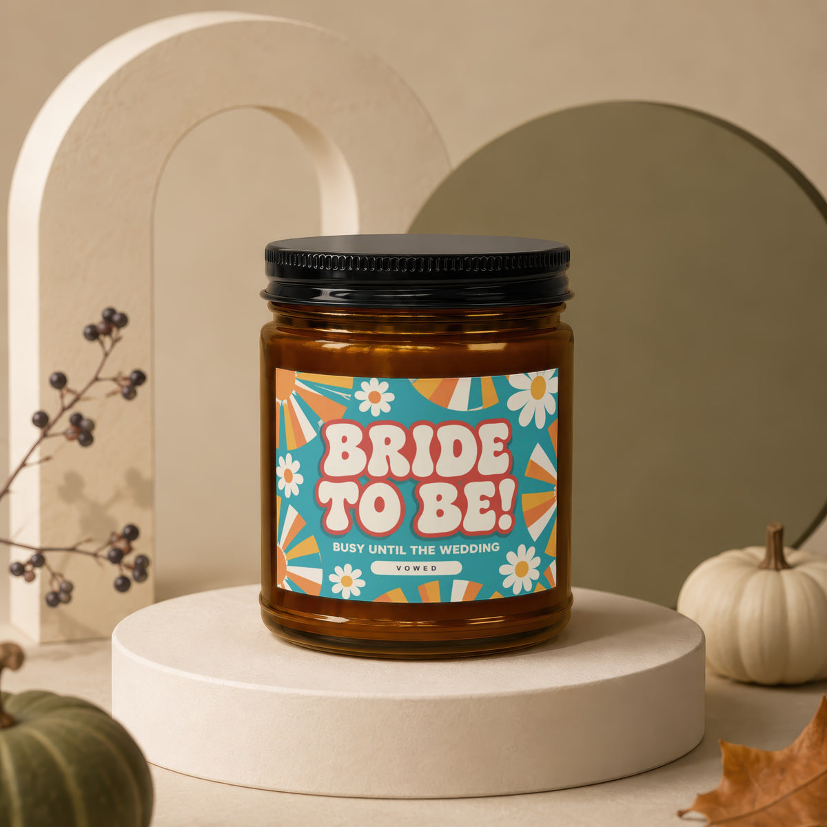 Candle with "BRIDE TO BE!" text, "BUSY UNTIL THE WEDDING," and "VOWED" on its label.