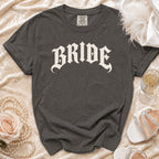 Dark grey t-shirt with "BRIDE" in gothic font and Comfort Colors tag.