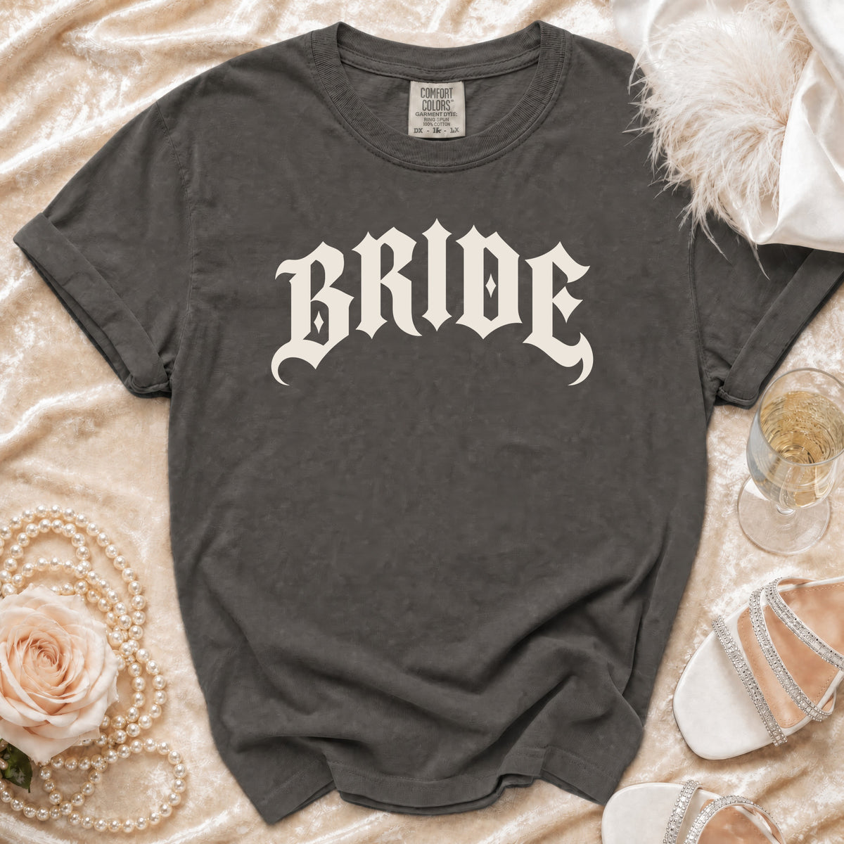 Dark grey t-shirt with "BRIDE" in gothic font and Comfort Colors tag.
