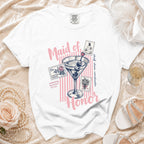 White t-shirt with "Maid of Honor" text, martini glass, and wedding stamps.
