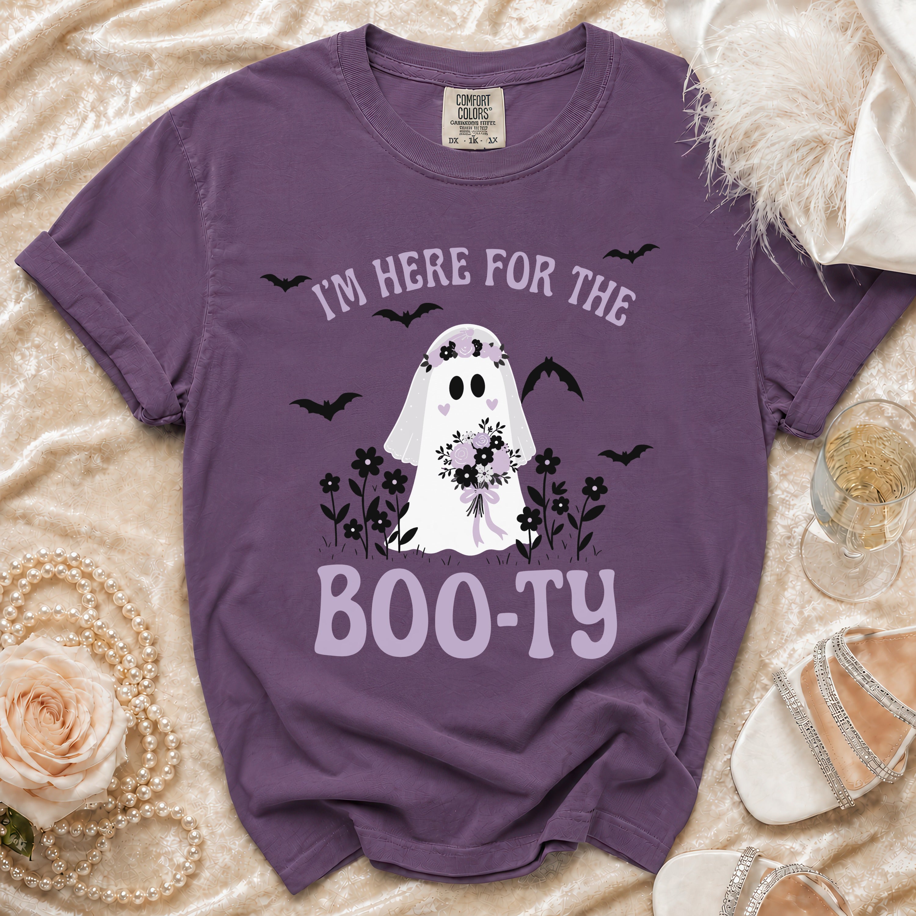 Purple t-shirt with ghost graphic and text "I'M HERE FOR THE BOO-TY".