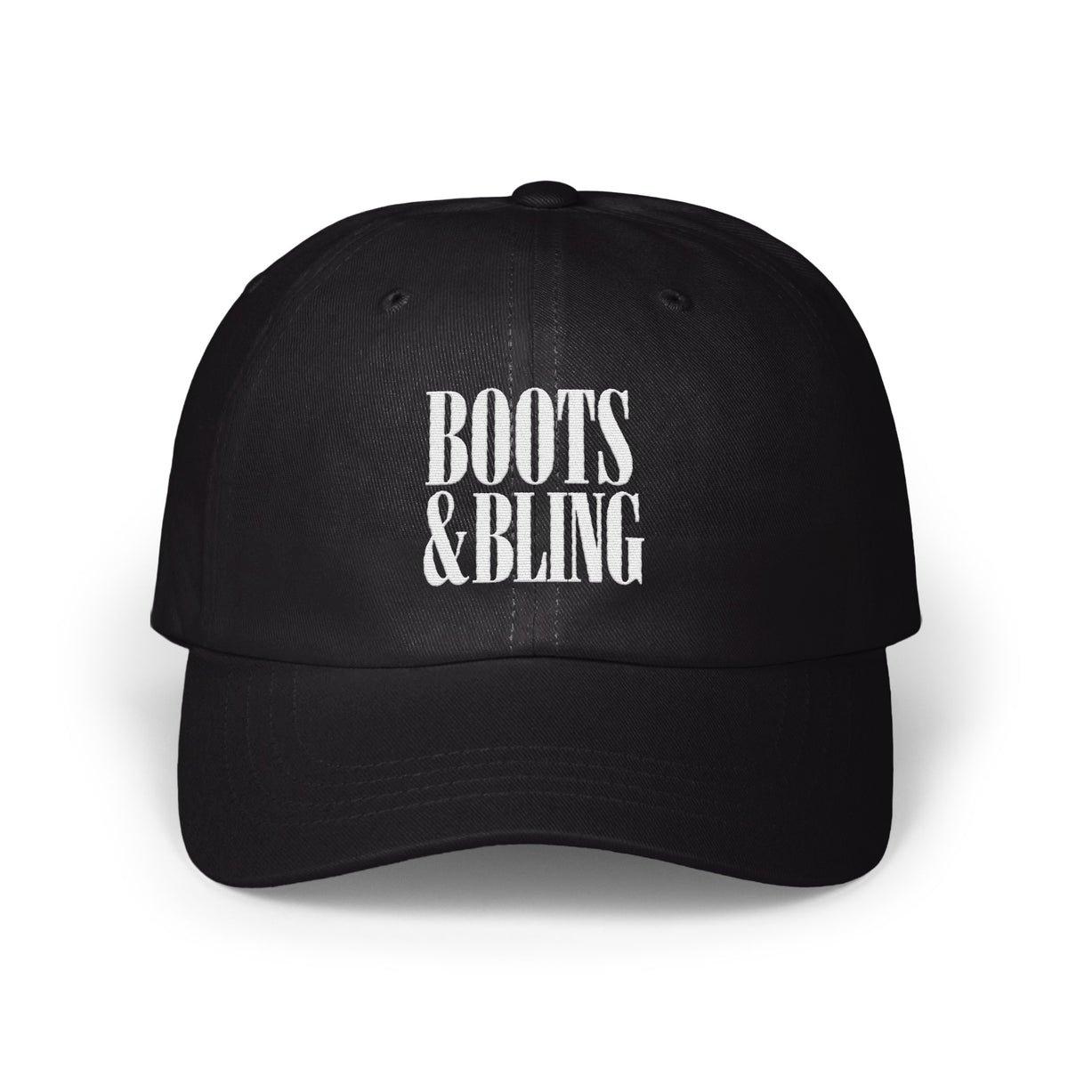 A black baseball cap with white embroidered text reading BOOTS & BLING centered on the front.
