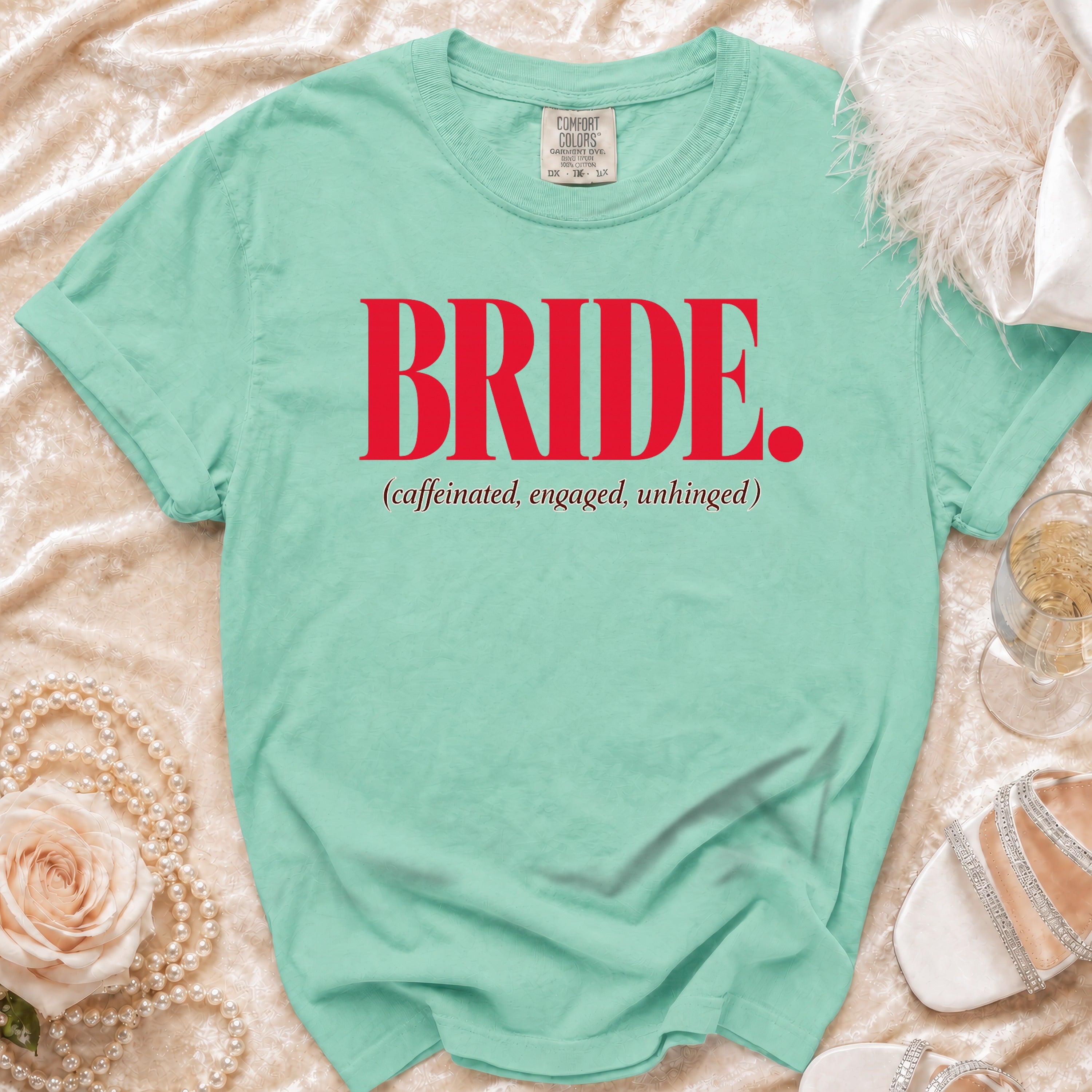 Mint green t-shirt with red text "BRIDE. (caffeinated, engaged, unhinged)"