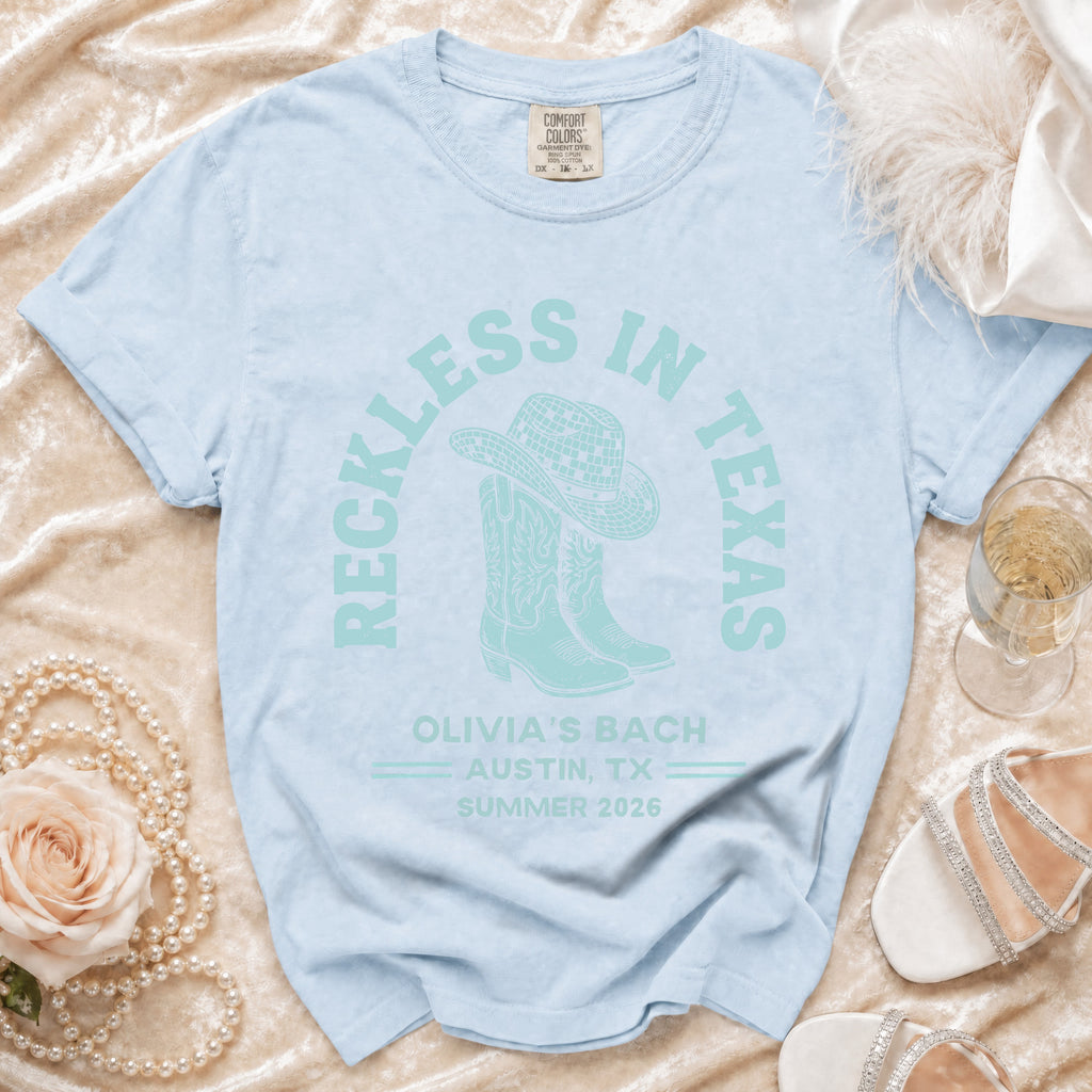 Light blue t-shirt with "Reckless in Texas" and bachelorette details.
