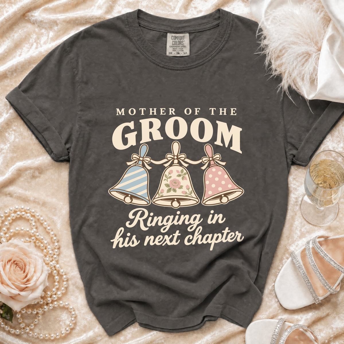 "Mother of the Groom" t-shirt with bells and "Ringing in his next chapter" text.