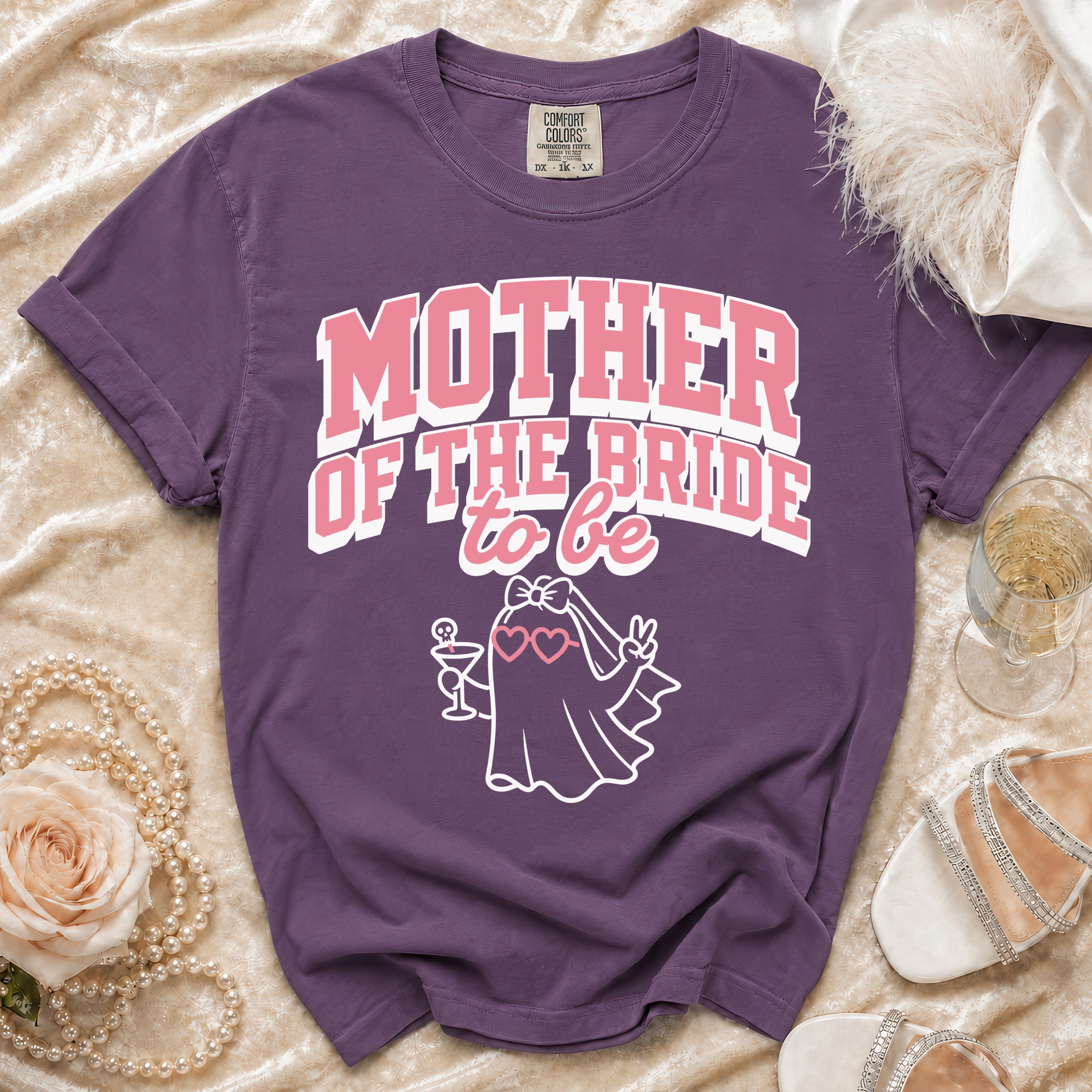 Purple t-shirt with "Mother of the Bride to be" text and ghost graphic.