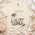 Cream t-shirt with "Just Married. Financially Irresponsible." and beach graphic for a couple.