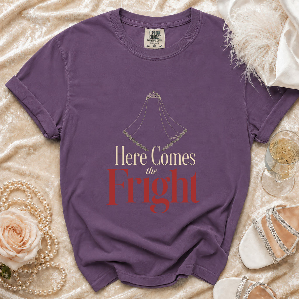 Purple t-shirt with a veil graphic and text "Here Comes the Fright".