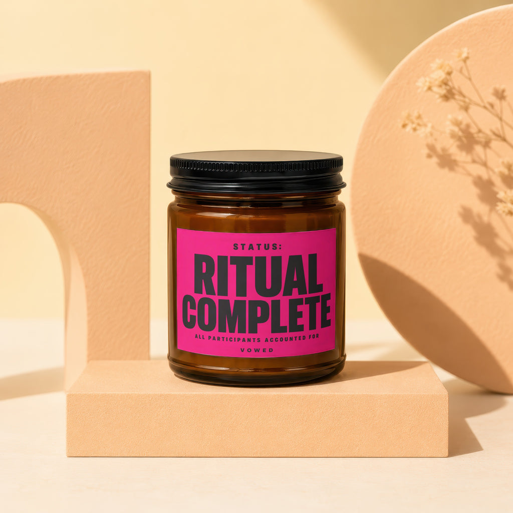 Brown glass jar with black lid, pink label reading "RITUAL COMPLETE".