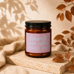 Candle with pink label reading "Happily ever after starts now" and "VOWED".