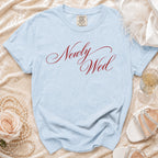 Light blue Comfort Colors t-shirt with "Newly Wed" in red script.