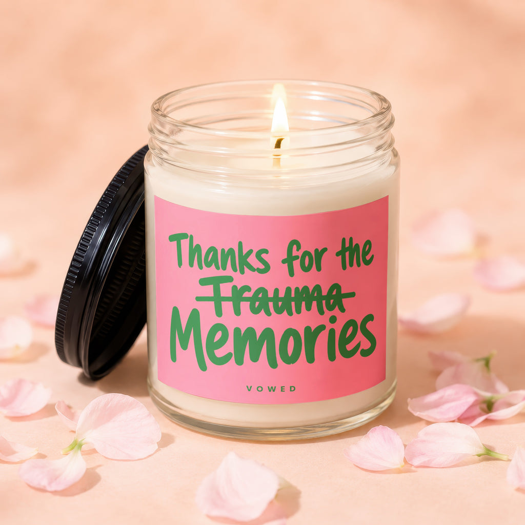 Candle with pink label reading "Thanks for the Trauma Memories" VOWED.
