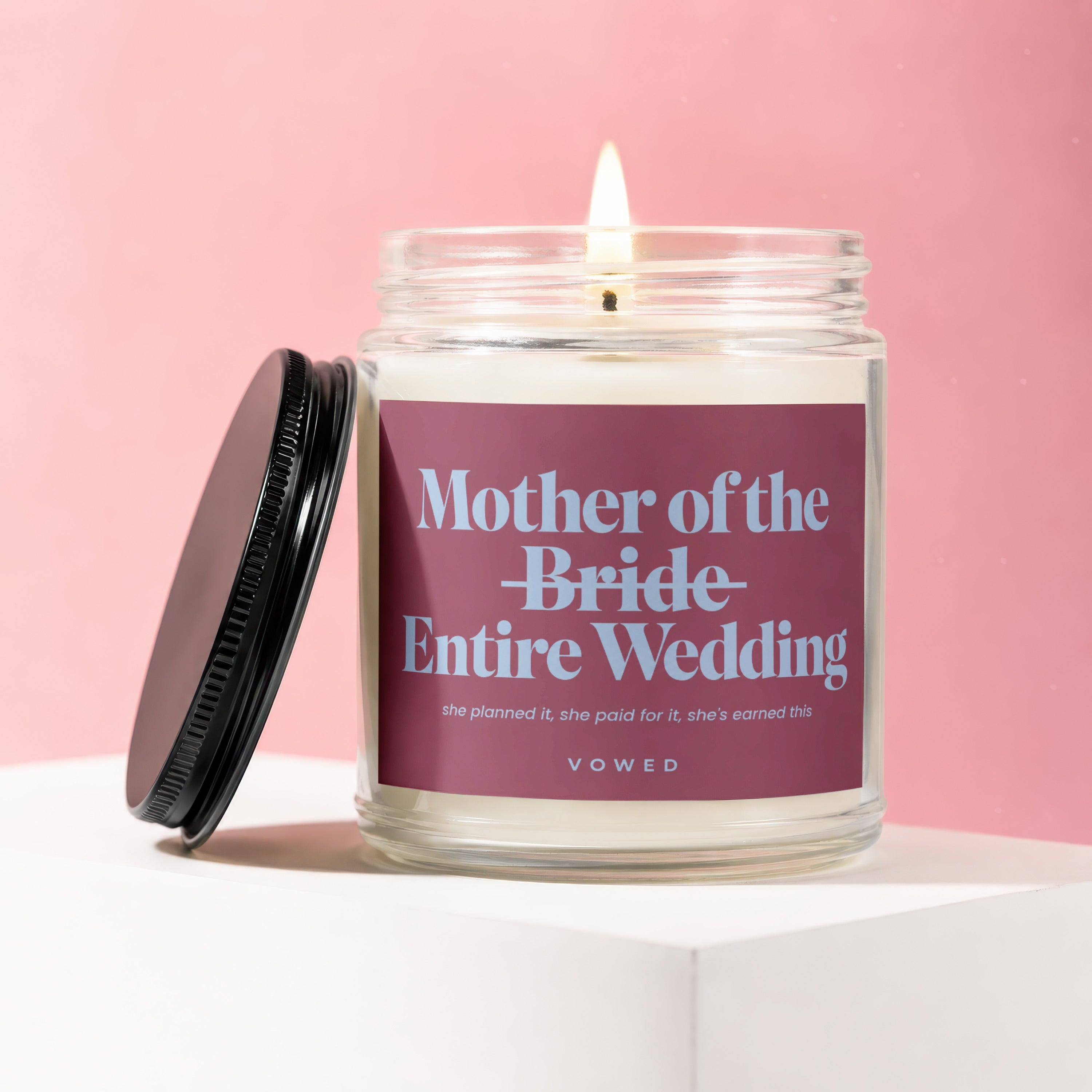 Candle reads "Mother of the Bride Entire Wedding" on a pink background.