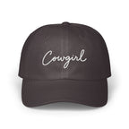 Dark gray baseball cap featuring the word Cowgirl embroidered in white cursive script across the front.
