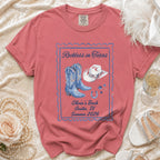 Pink t-shirt with "Reckless in Texas" and "Olivia's Bach Austin, TX Summer 2026" text.