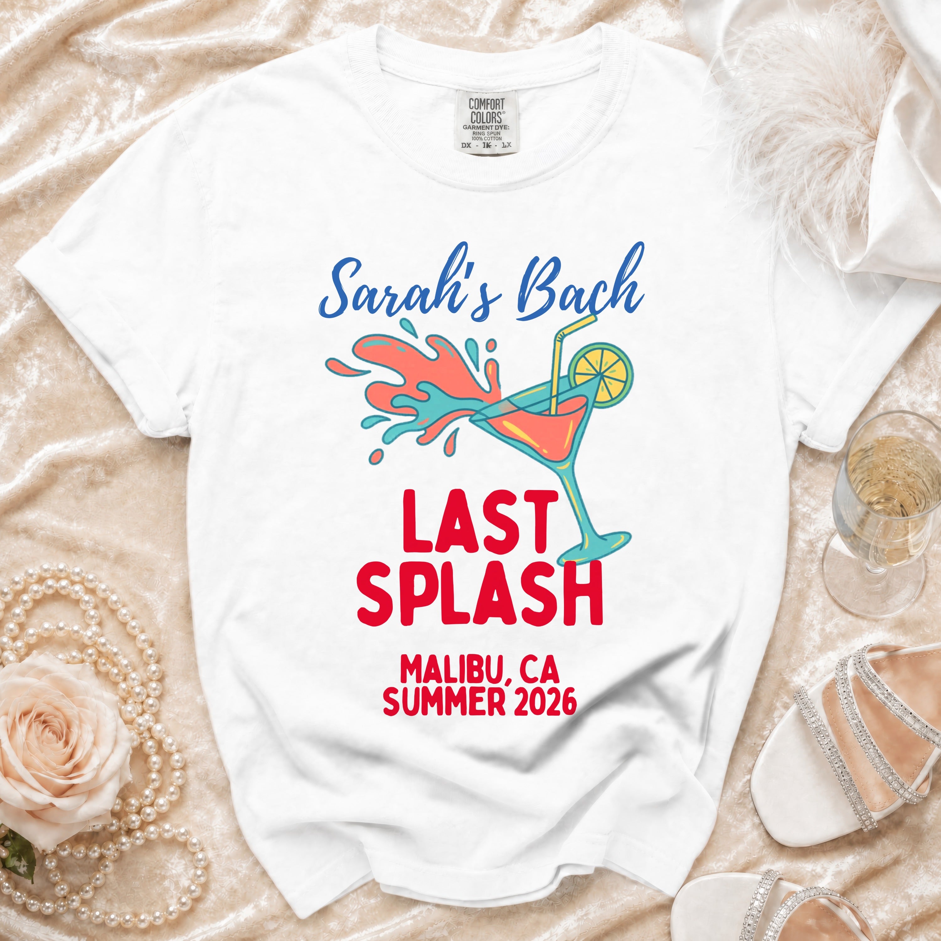 White t-shirt with "Sarah's Bach Last Splash Malibu, CA Summer 2026" text and graphic.