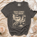 Dark grey t-shirt with "HERE COMES THE BRIDE" and dragon graphic.