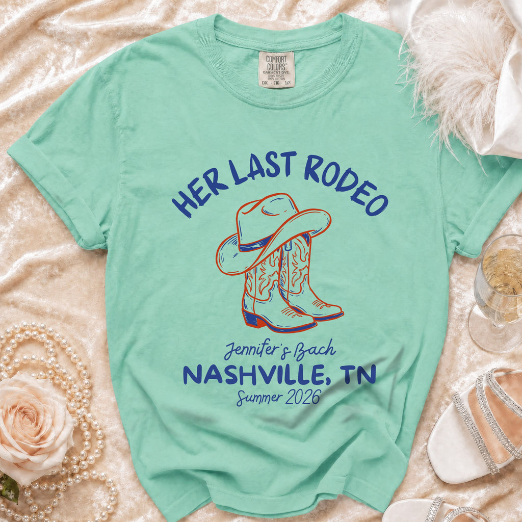 Aqua t-shirt with "Her Last Rodeo" and cowboy boots graphic.
