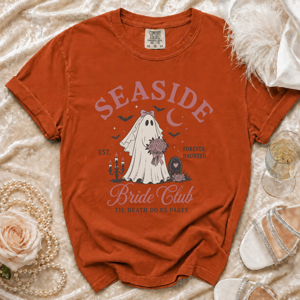 Orange t-shirt with "Seaside Bride Club" ghost graphic and "Til Death Do Us Party."