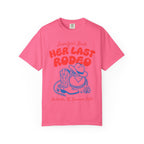 Pink t-shirt with "Jennifer's Bach Her Last Rodeo" and cowboy boots.