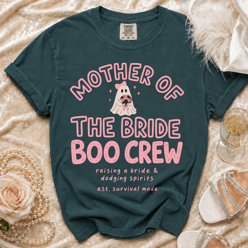 Teal t-shirt with pink "Mother of the Bride Boo Crew" graphic and text.